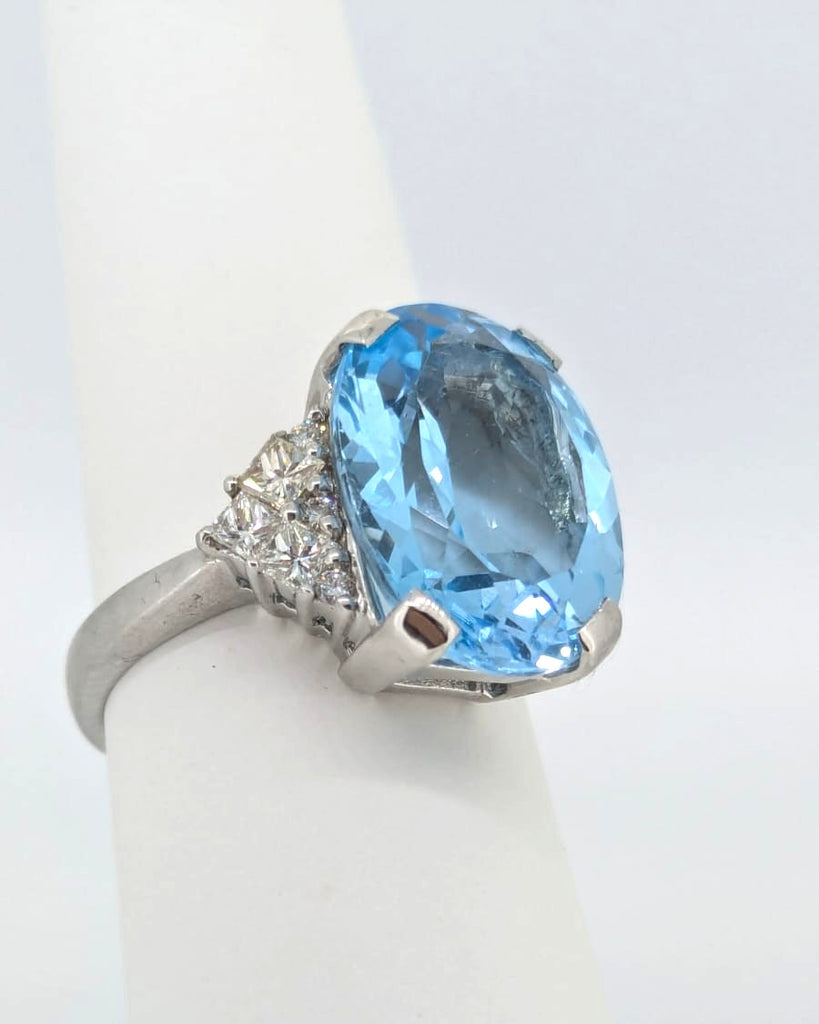 18ct White Gold ring set with single Blue Topaz and Diamonds