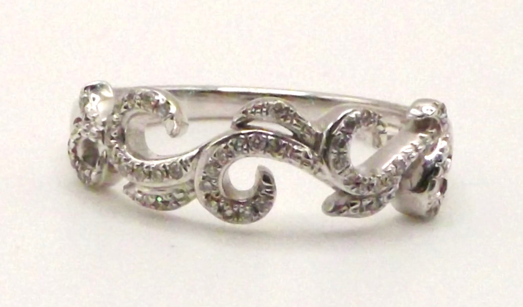 9 ct White Gold swirl design ring with diamonds