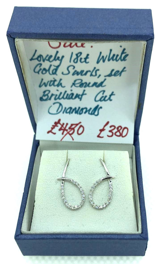 18 ct White Gold swirl earrings with diamonds
