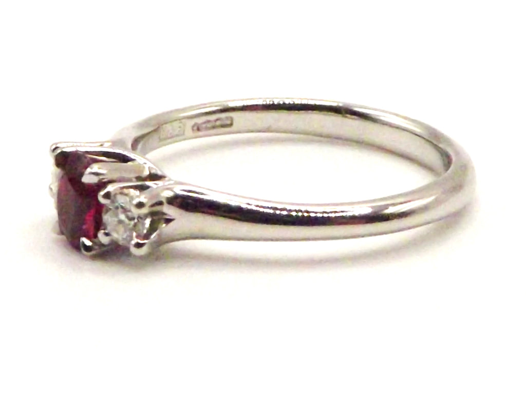 Platinum ring with central Ruby and Diamond surround