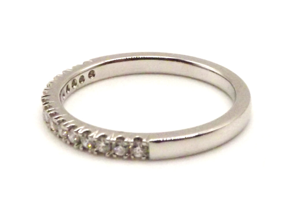 Platinum half eternity ring set with round diamonds