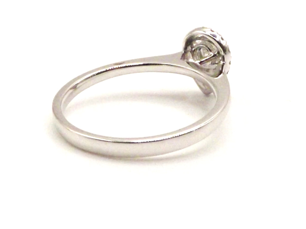 Platinum Halo design ring with 0.30 ct pear shaped diamond