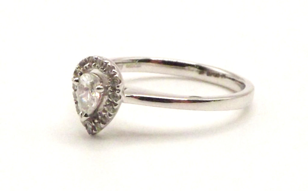 Platinum Halo design ring with 0.30 ct pear shaped diamond