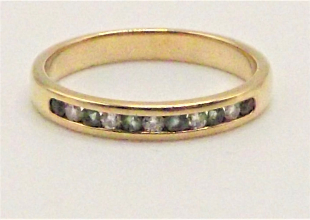 18 ct Yellow Gold ring with channel set Emeralds and Diamonds