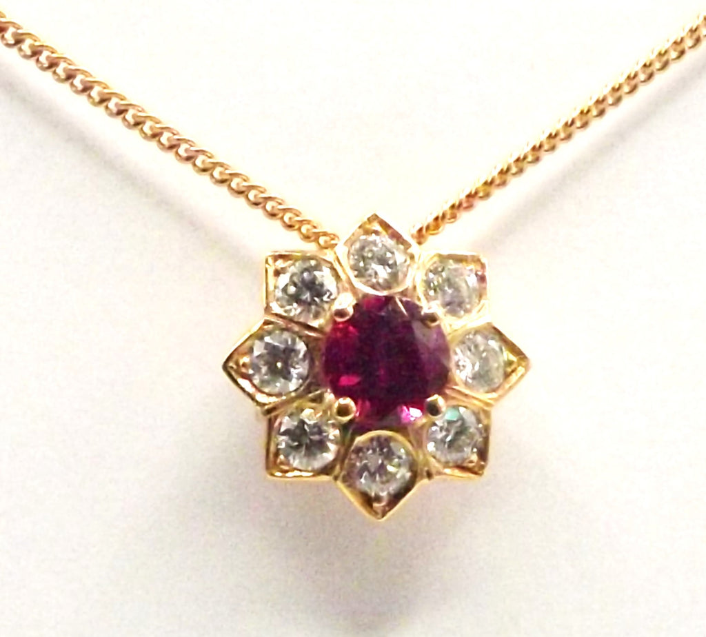 18ct Rose Gold Pendant set with a 0.3ct Ruby surrounded by Brilliant Cut Diamonds