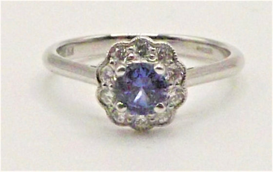 Platinum ring with flower set 0.51 ct Sapphire with Diamonds