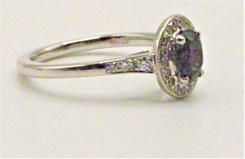 Platinum ring with Touramaline surrounded by Diamonds