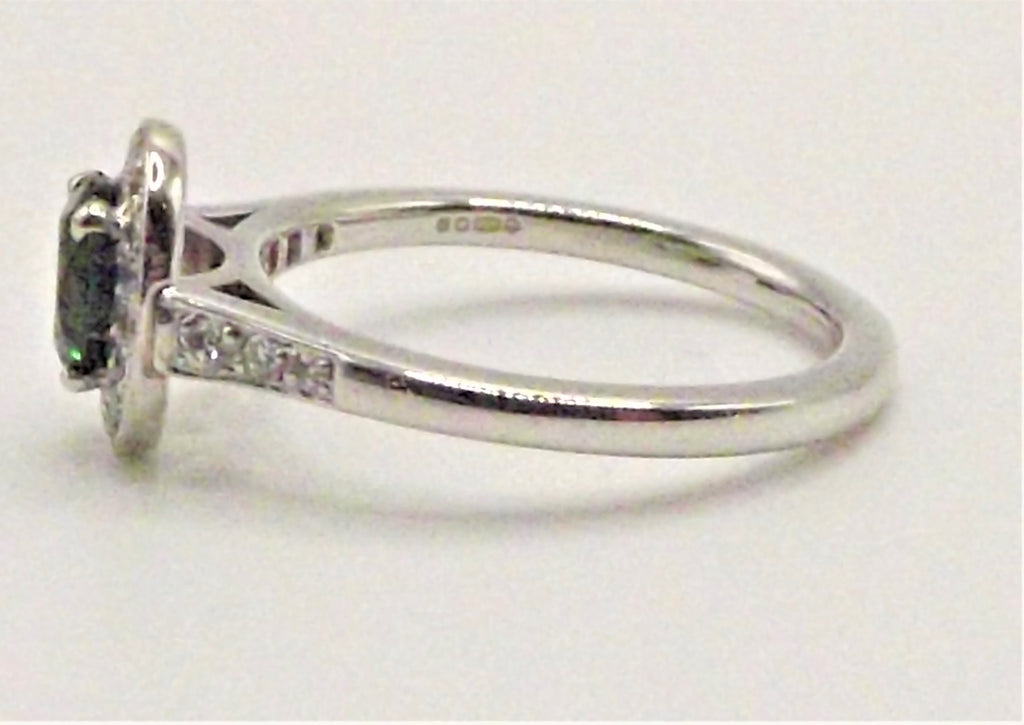 Platinum ring with Touramaline surrounded by Diamonds